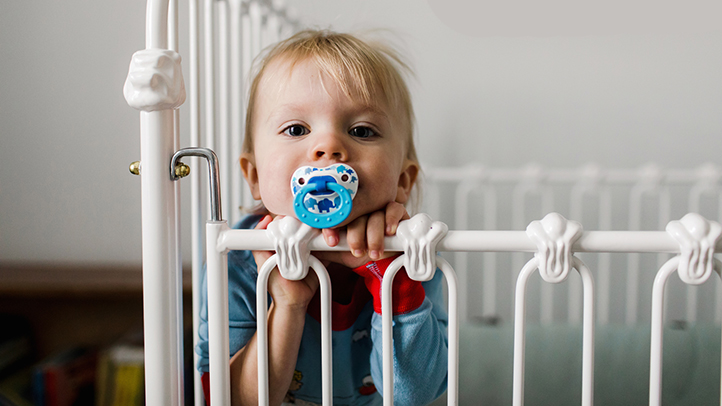awake baby in crib, baby in crib during 12 month sleep regression