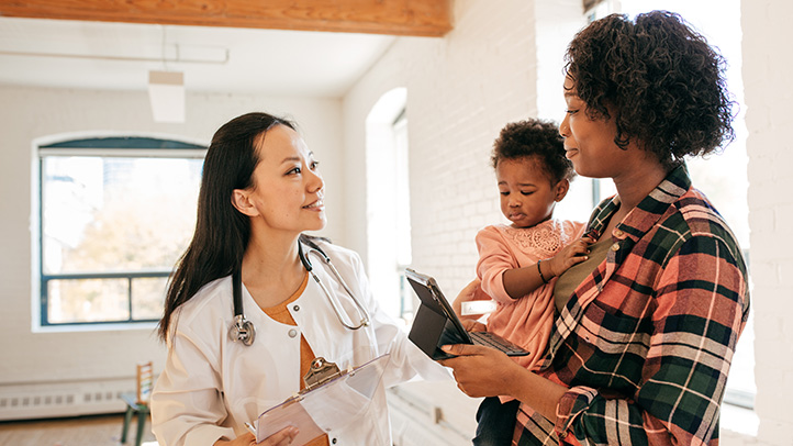 mom and baby at pediatrician's office, decoding your child's cough symptoms
