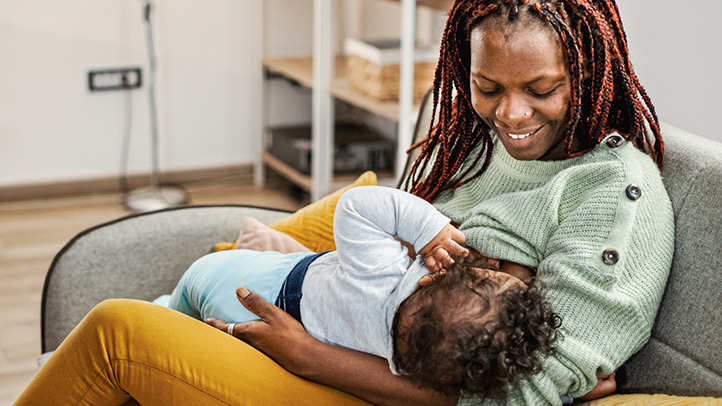 extended breastfeeding, Black mom nursing her baby