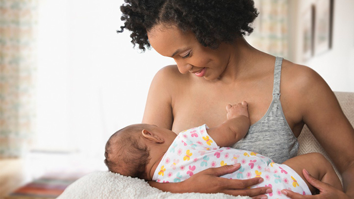 mom breastfeeding baby