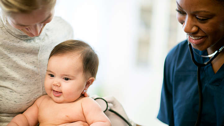 baby with mom at doctor's, polio vaccine