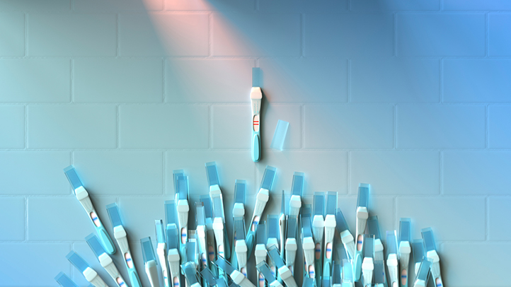 pregnant at 45, conceptual image of blue candles with one rising above the rest