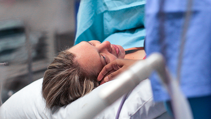 mother being comforted by doula before delivery