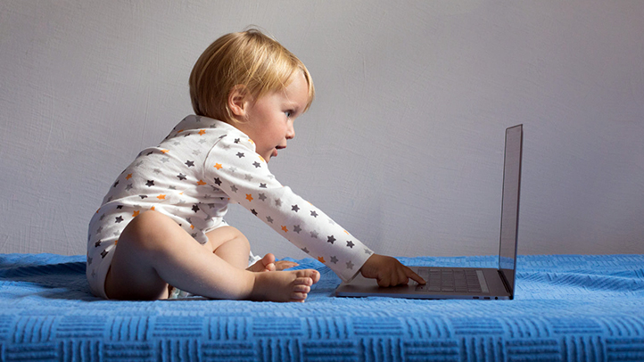 toddler on laptop