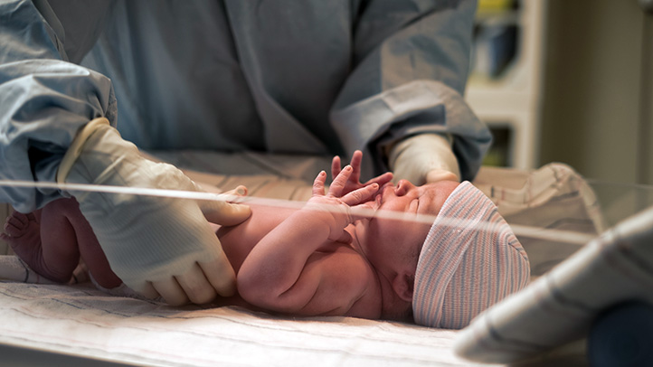 newborn baby getting examined by doctor, your baby's apgar tests and scores
